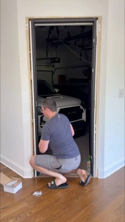 Installing a single steel door at a garage entry
